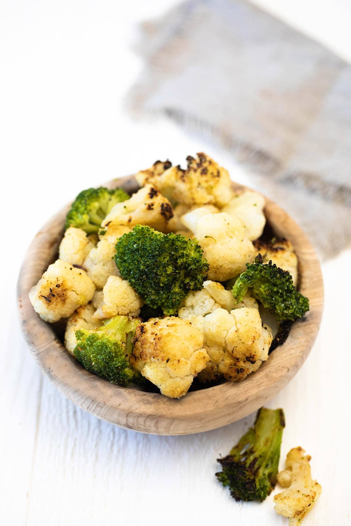Air Fryer Frozen Broccoli Cauliflower in a wooden bowl