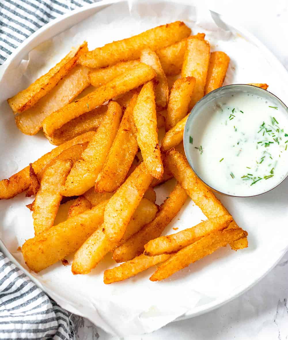 Baked Jicama Fries on white plate white backgorund