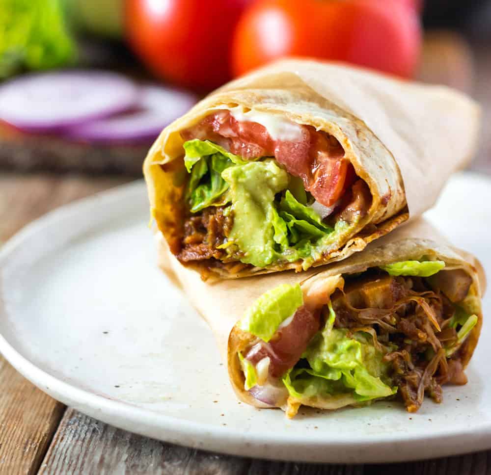 Vegan BBQ Jackfruit Wraps on white palte