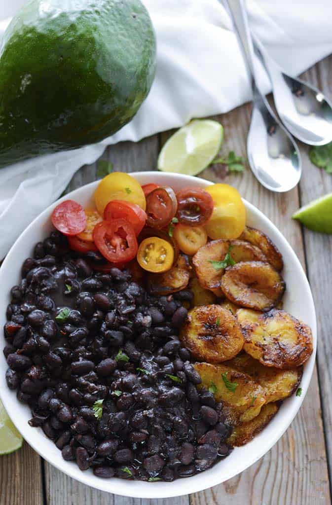 Vegan Brazilian Black Bean Stew (Feijoada) in white plate