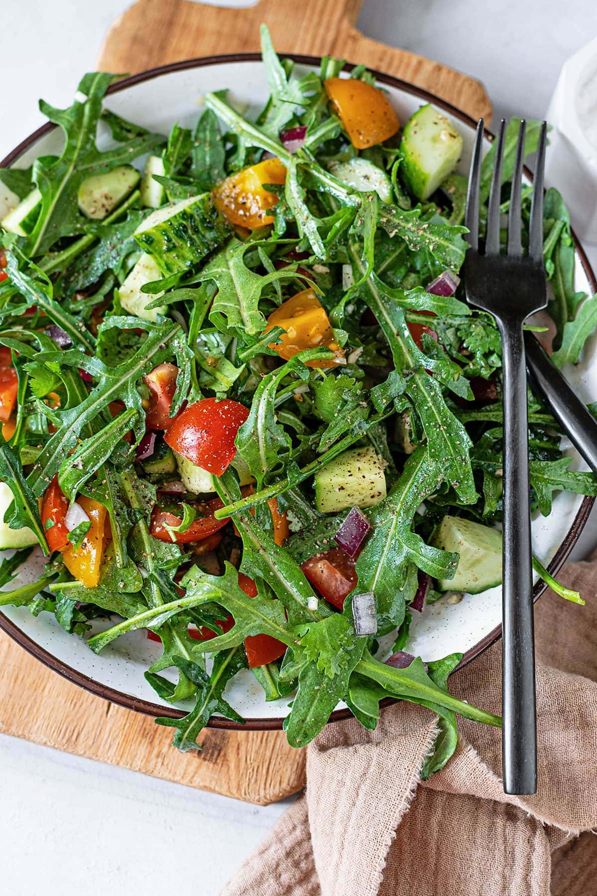 Vegan Candida-Friendly Salad in a white bowl on a wooden board