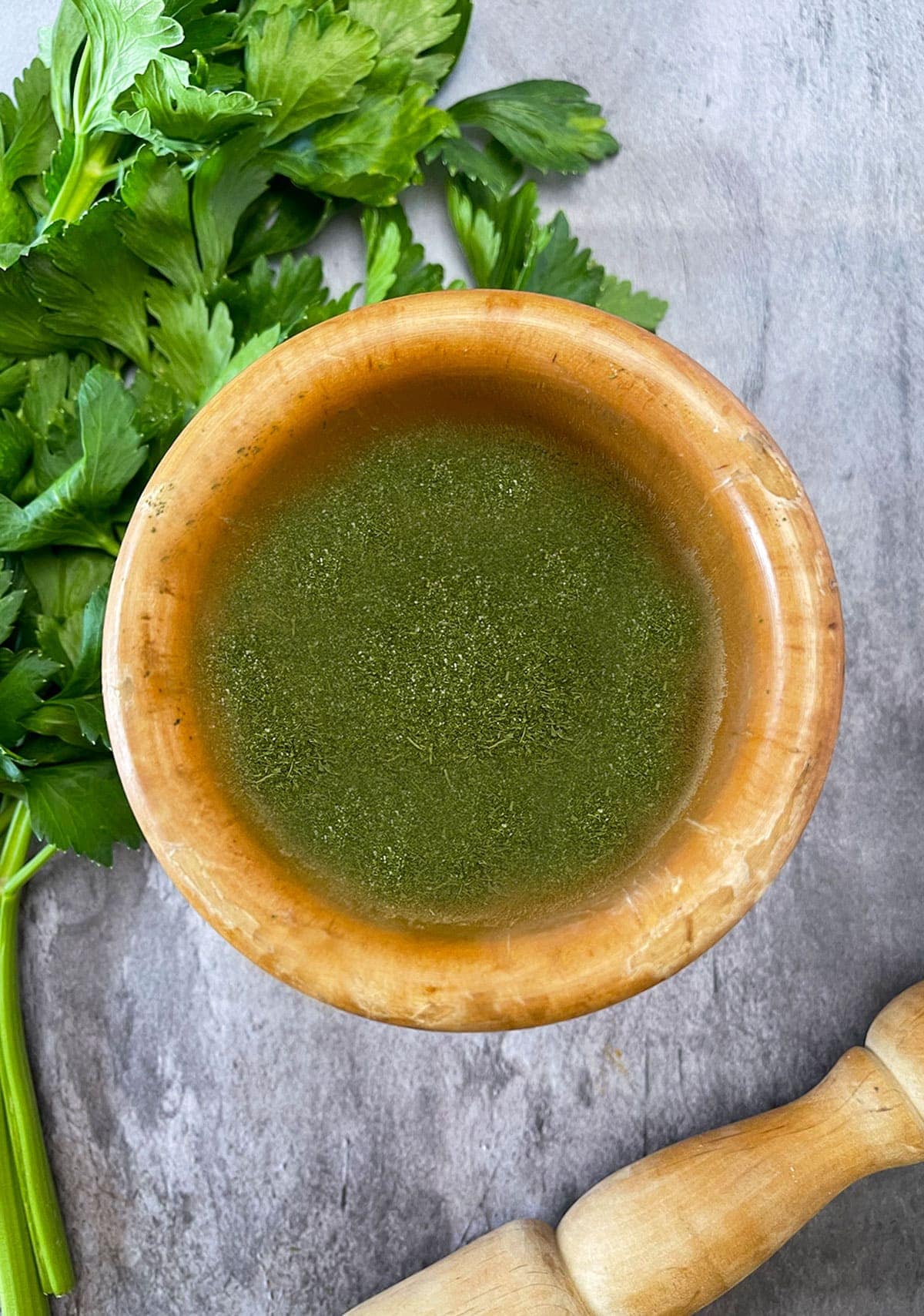Homemade Celery Salt on a wwooden bowl