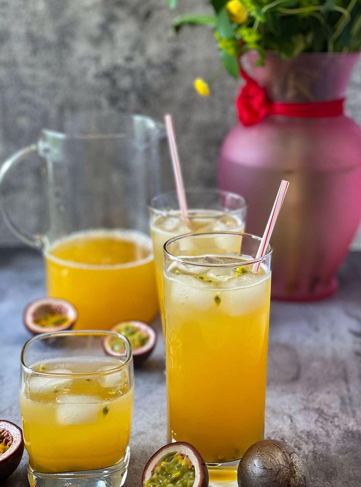 Passion Fruit Juice in a glass cup on grey background