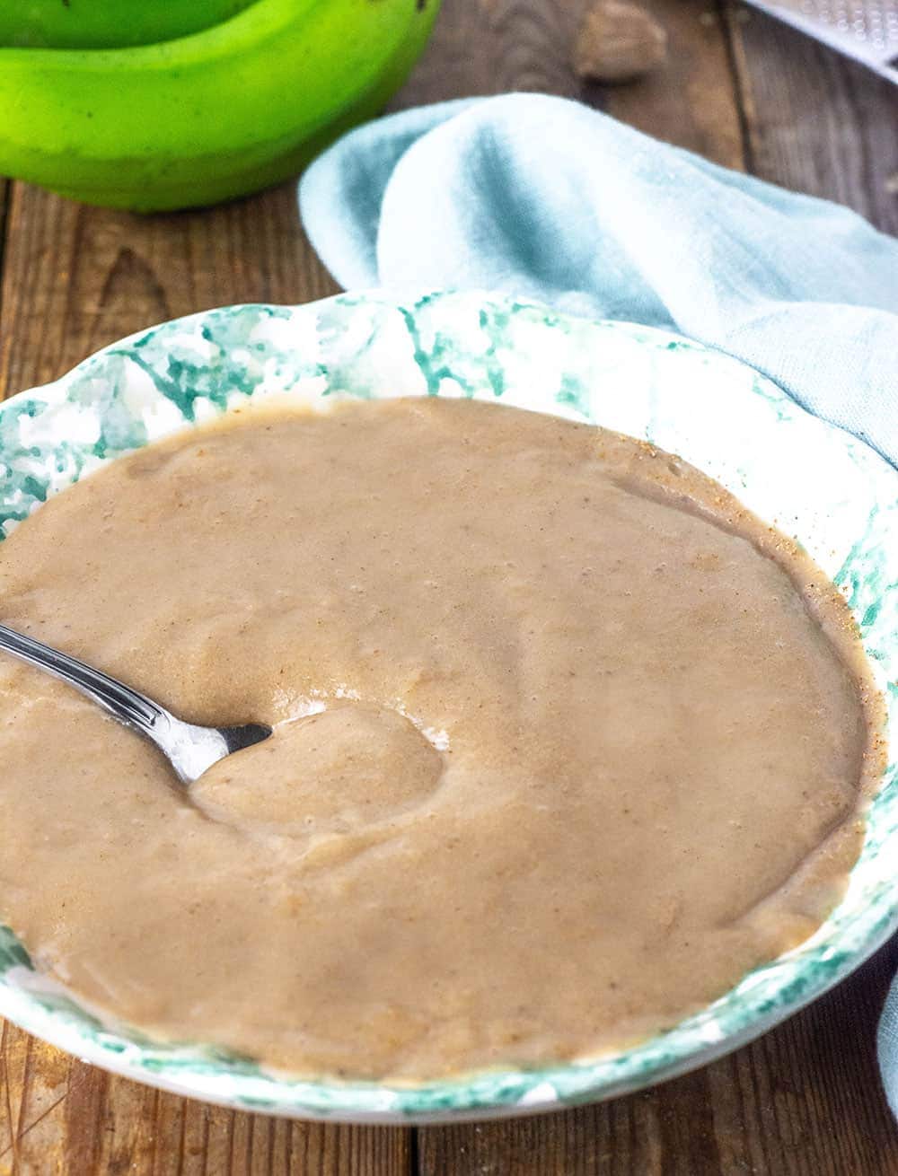 Banana Porridge on white bowl wooden background
