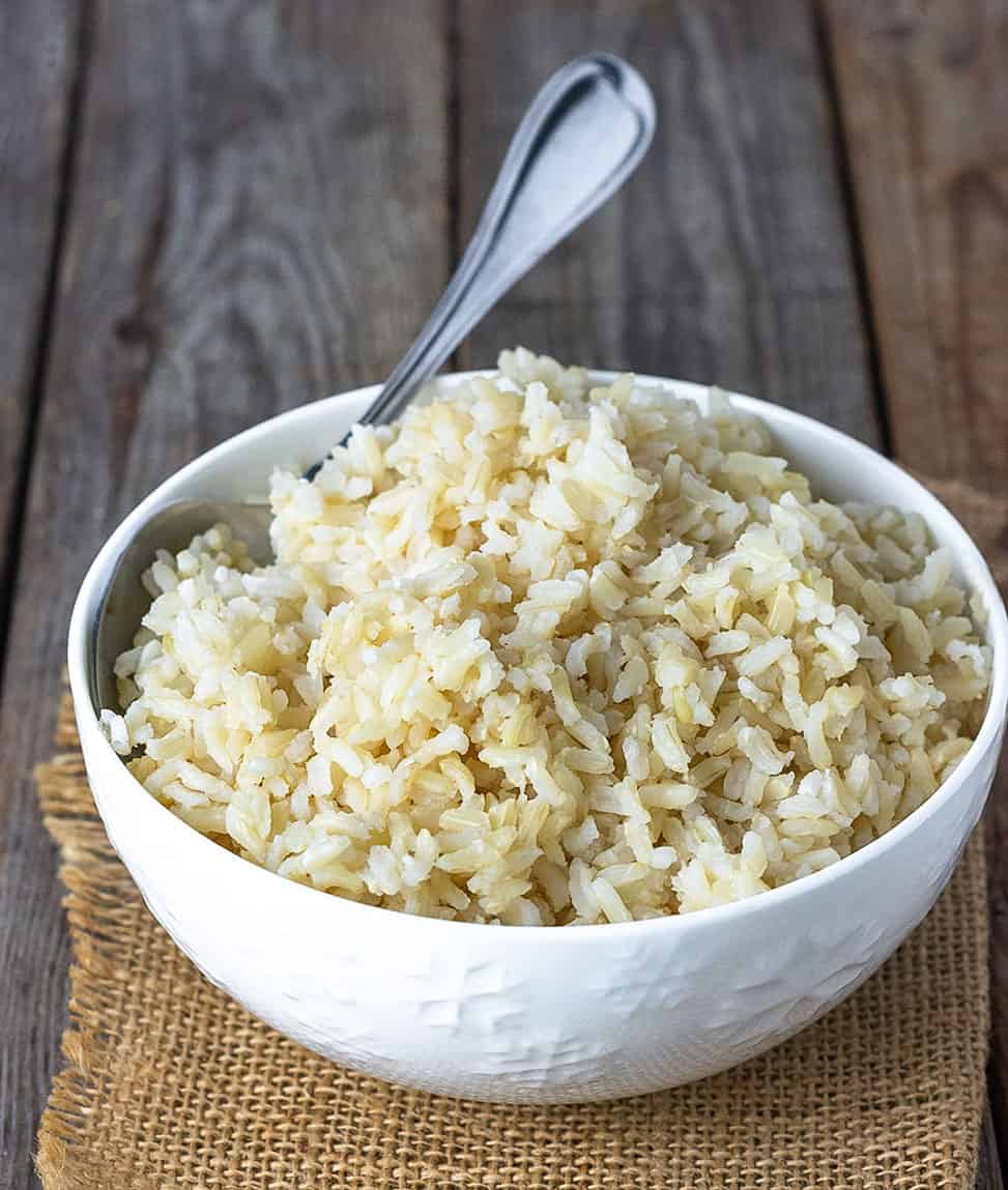 jasmine brown rice on white bowl on wooden background