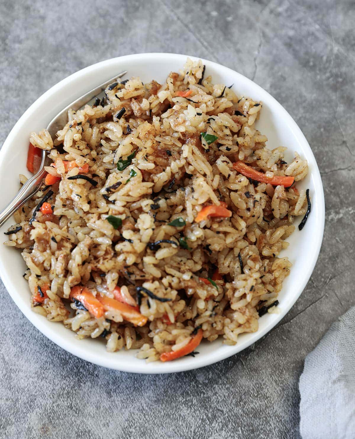 Copycat Trader Joe’s Japanese Fried Rice in a white bowl grey background