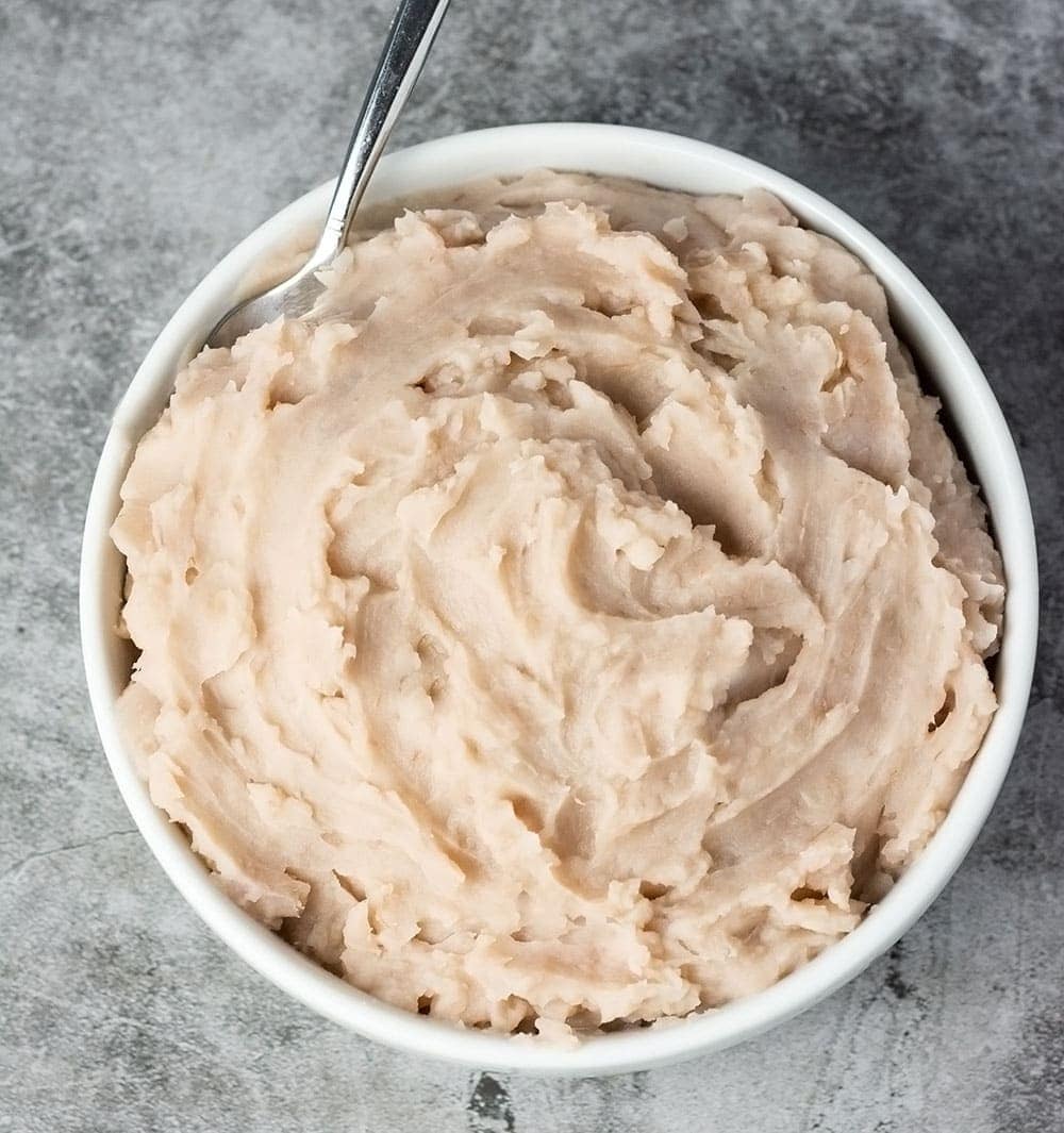 Mashed taro on white bowl on grey background