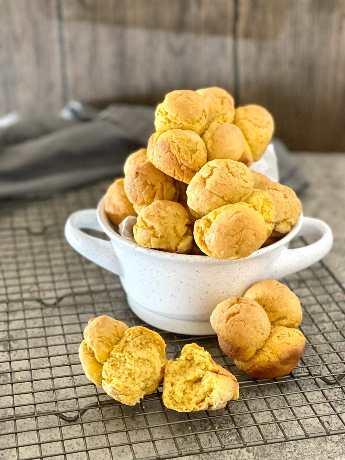 Vegan Gluten-Free Pumpkin Cloverleaf Rolls in a white bowl