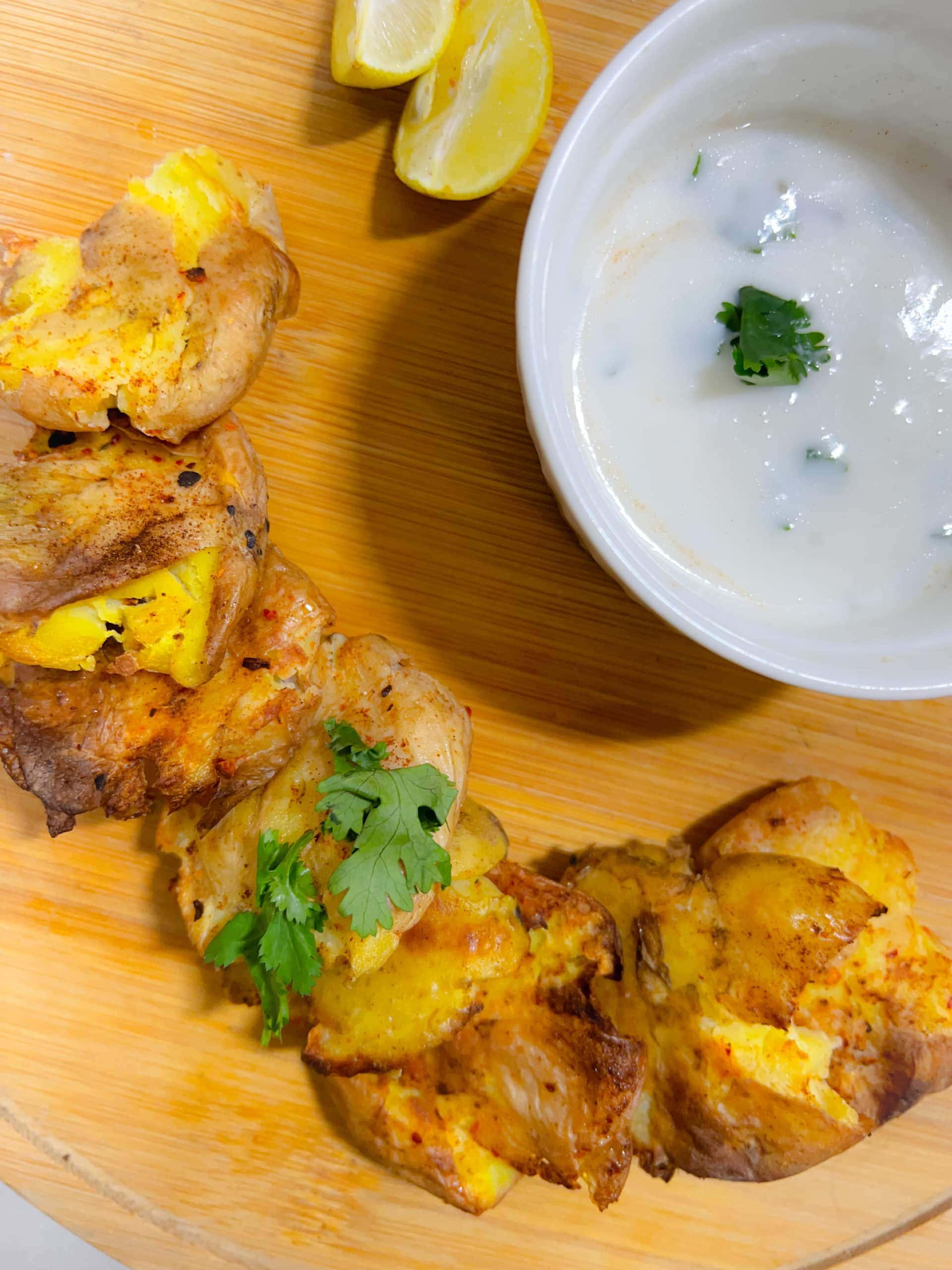 smashed potato bites on wooden board
