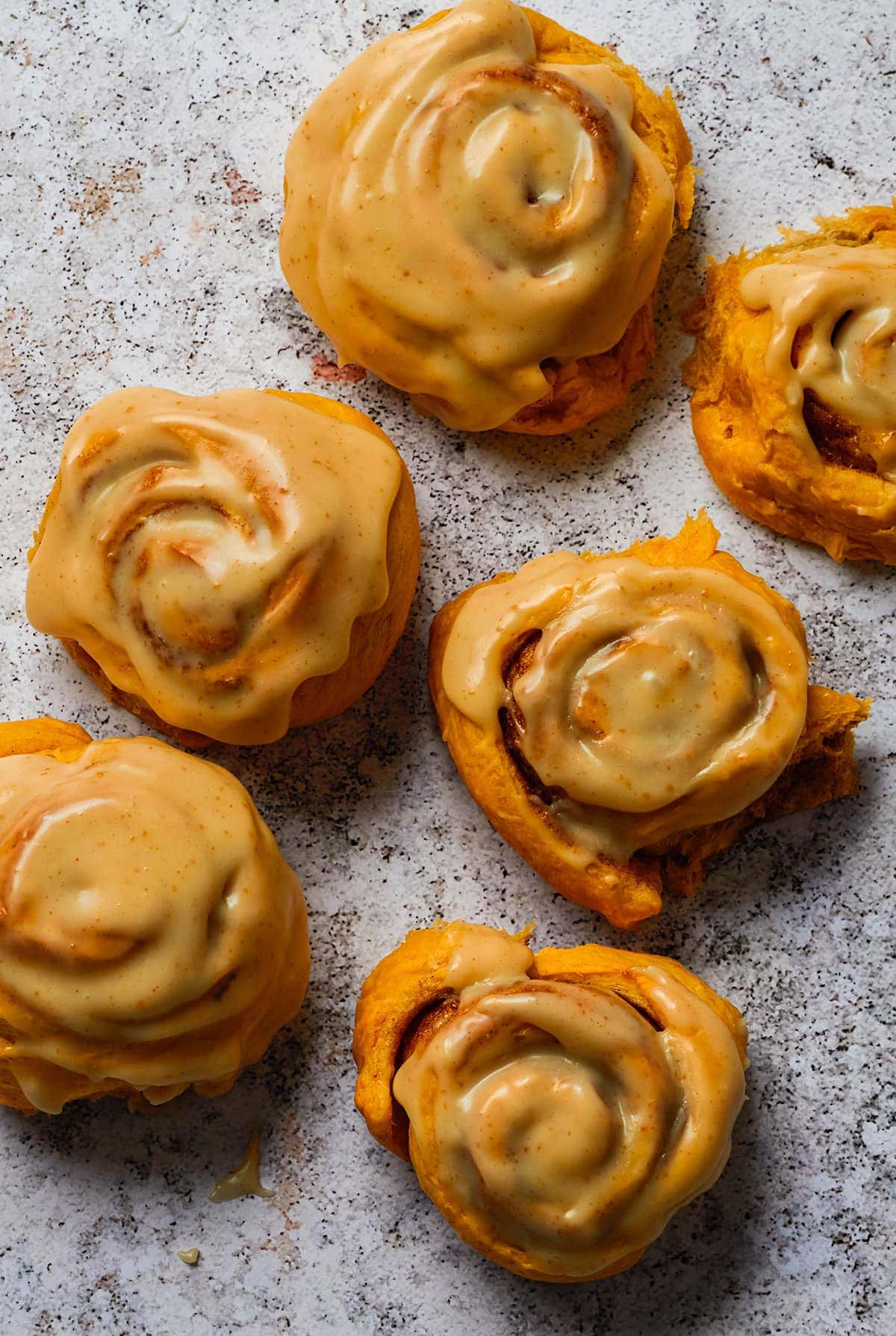 Sweet Potato Cinnamon Rolls on a grey background