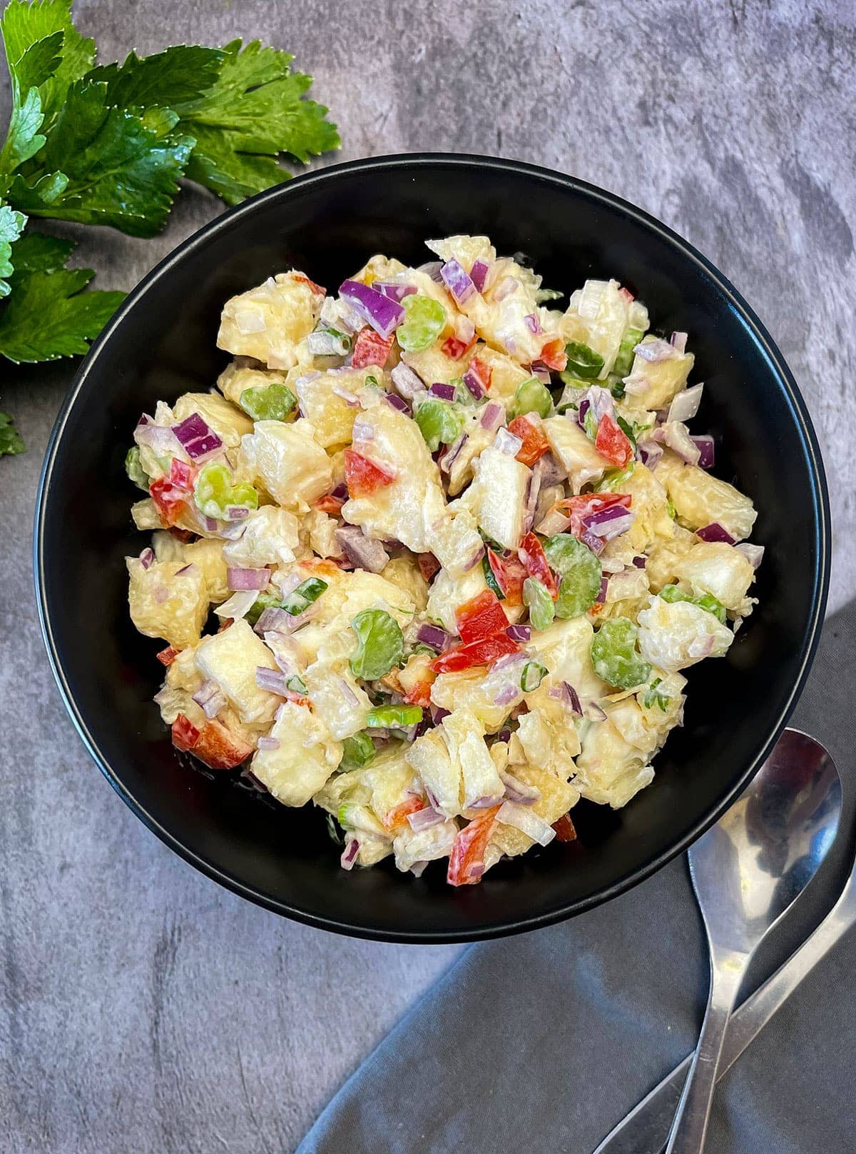 Yucca Salad (Cassava Salad) in black bowl