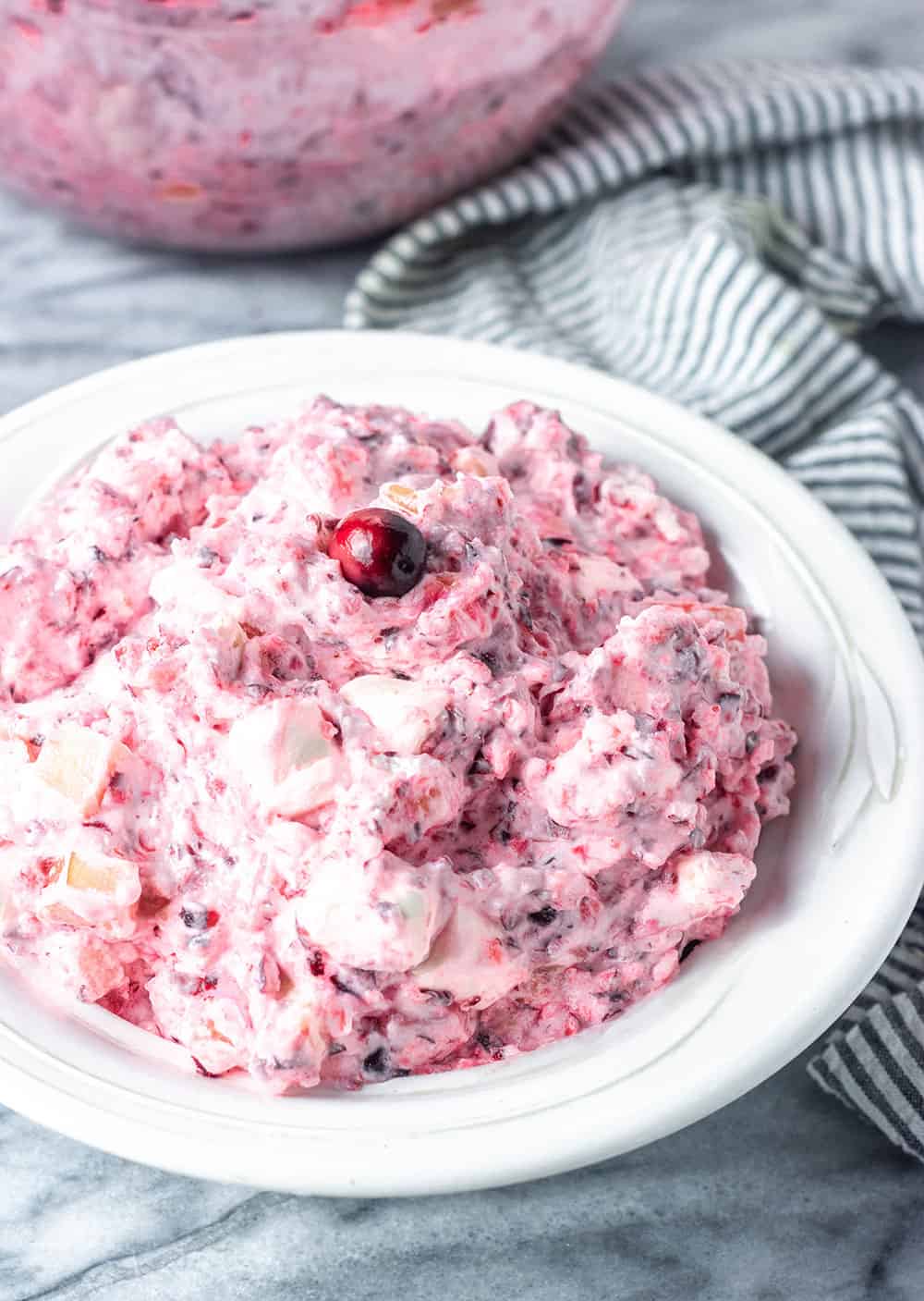 Vegan Cranberry Fluff in white bowl on white background