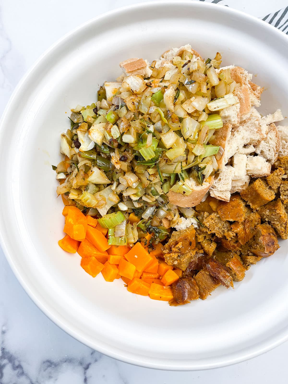 butternut squash stuffing in a white bowl on a white background