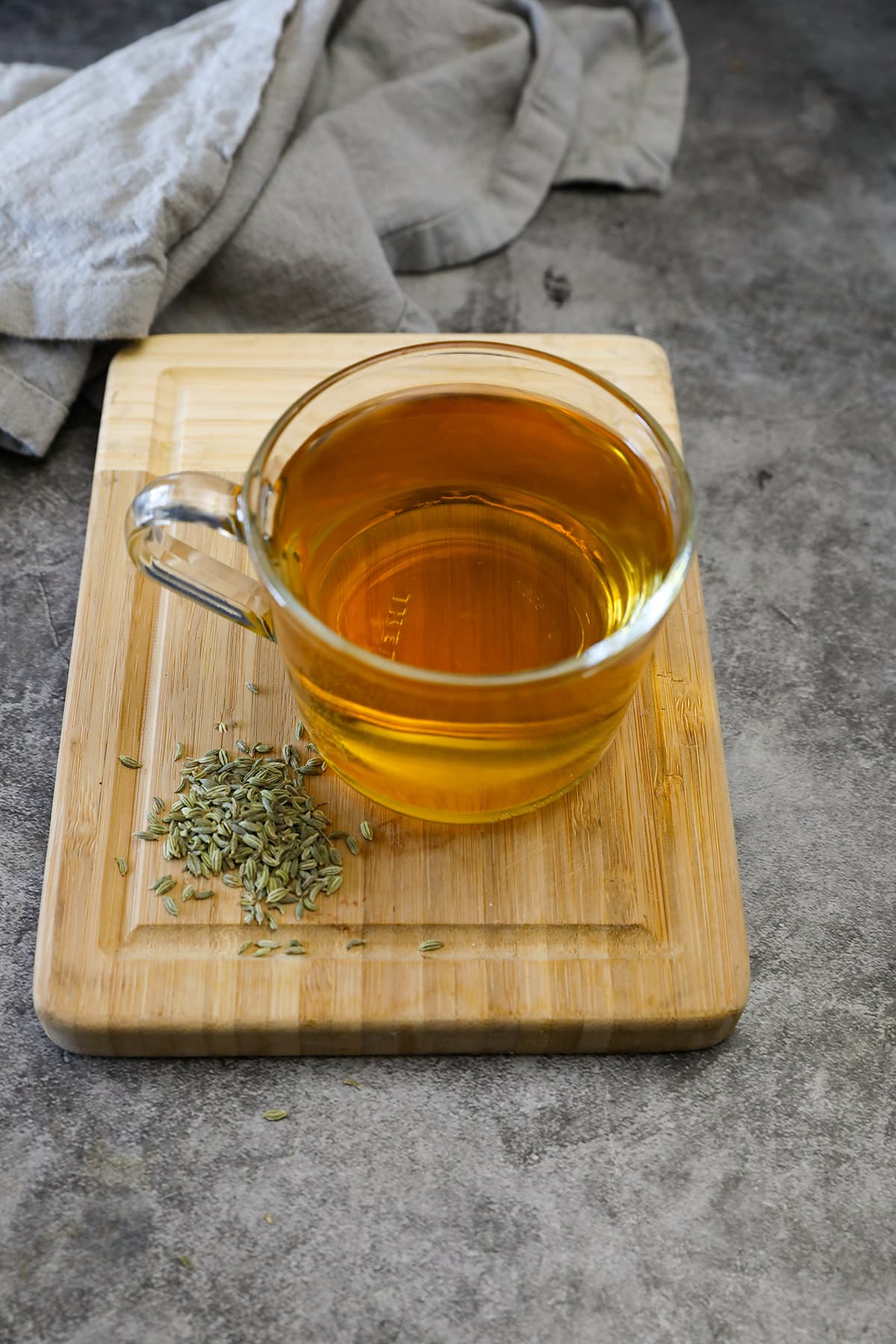 fennel seed tea on a wooden cutting board