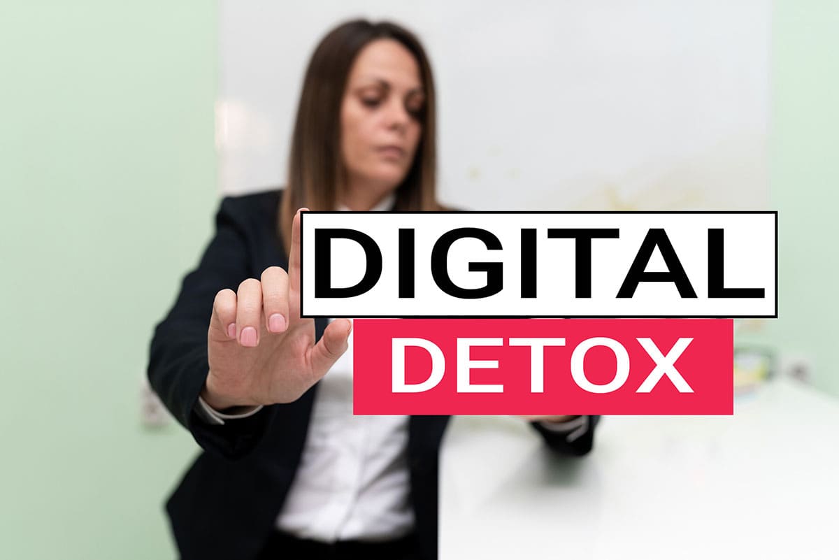 Digital detox female pushing sign away