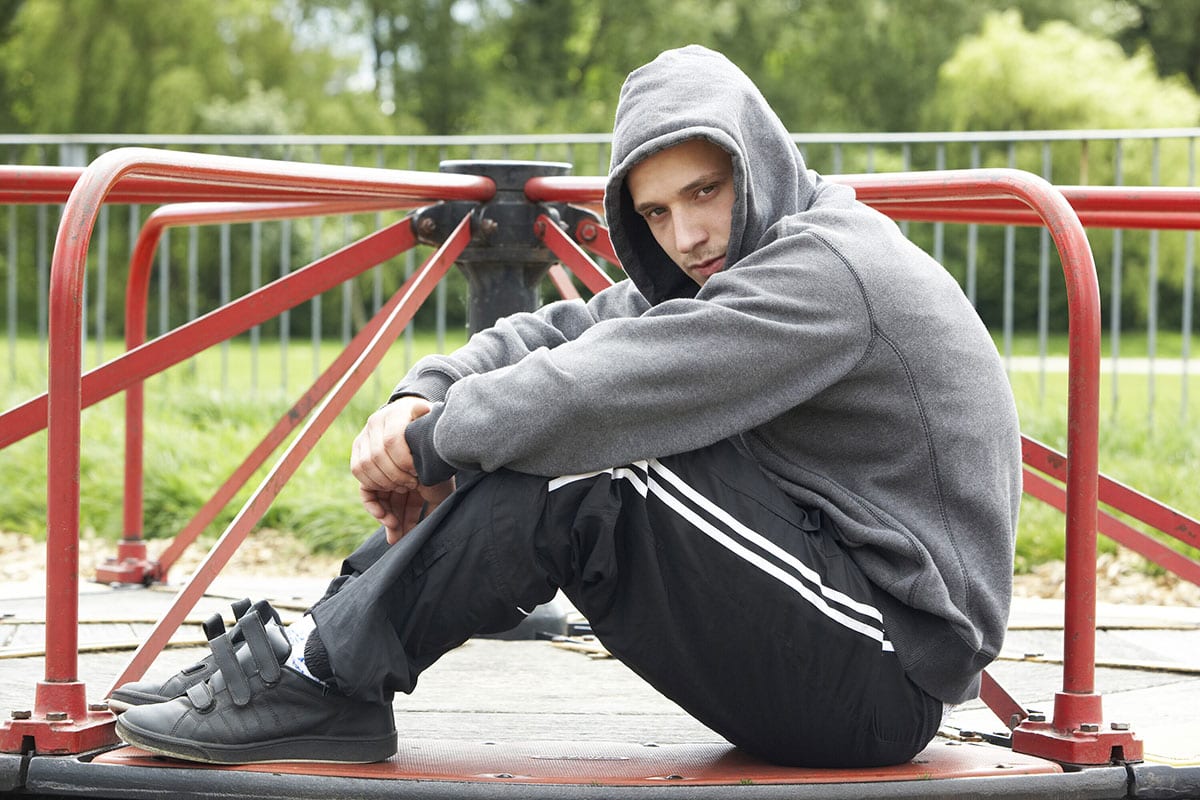 Depressed teen ot playground